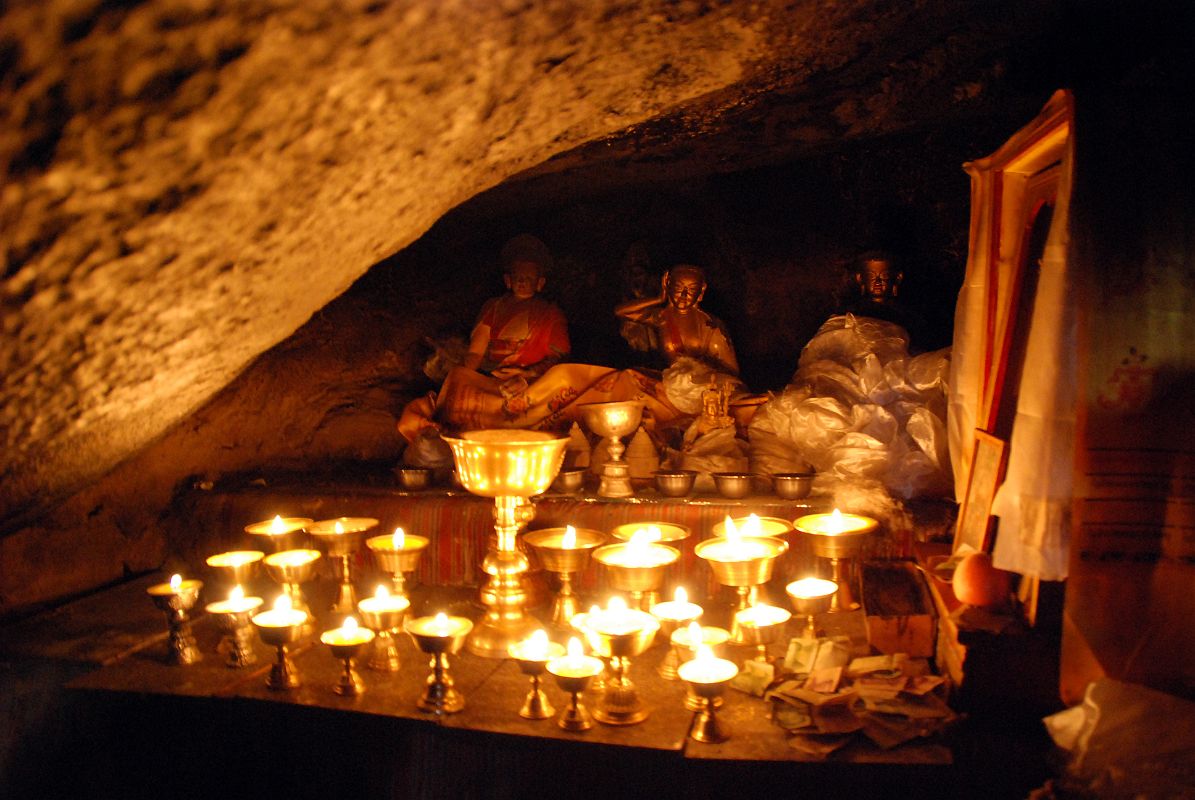 35 Cave Of The Female Yak Horns At The Back Of Dirapuk Gompa Has Statues Of Gotsangpa and Milarepa On Mount Kailash Outer Kora The cave of the female yak horns at Dirapuk Gompa has a slanted roof with statues of Gotsangpa and Milarepa on the seat where Gotsangpa meditated for three years.